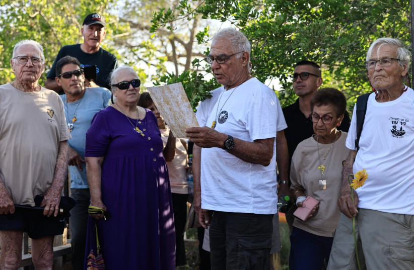Released Israeli hostage Gadi Mozes at a ceremony marking rebuilding in Kibbutz Nir Oz, August 7, 2025. (credit: Tsafrir Abayov/Flash90)